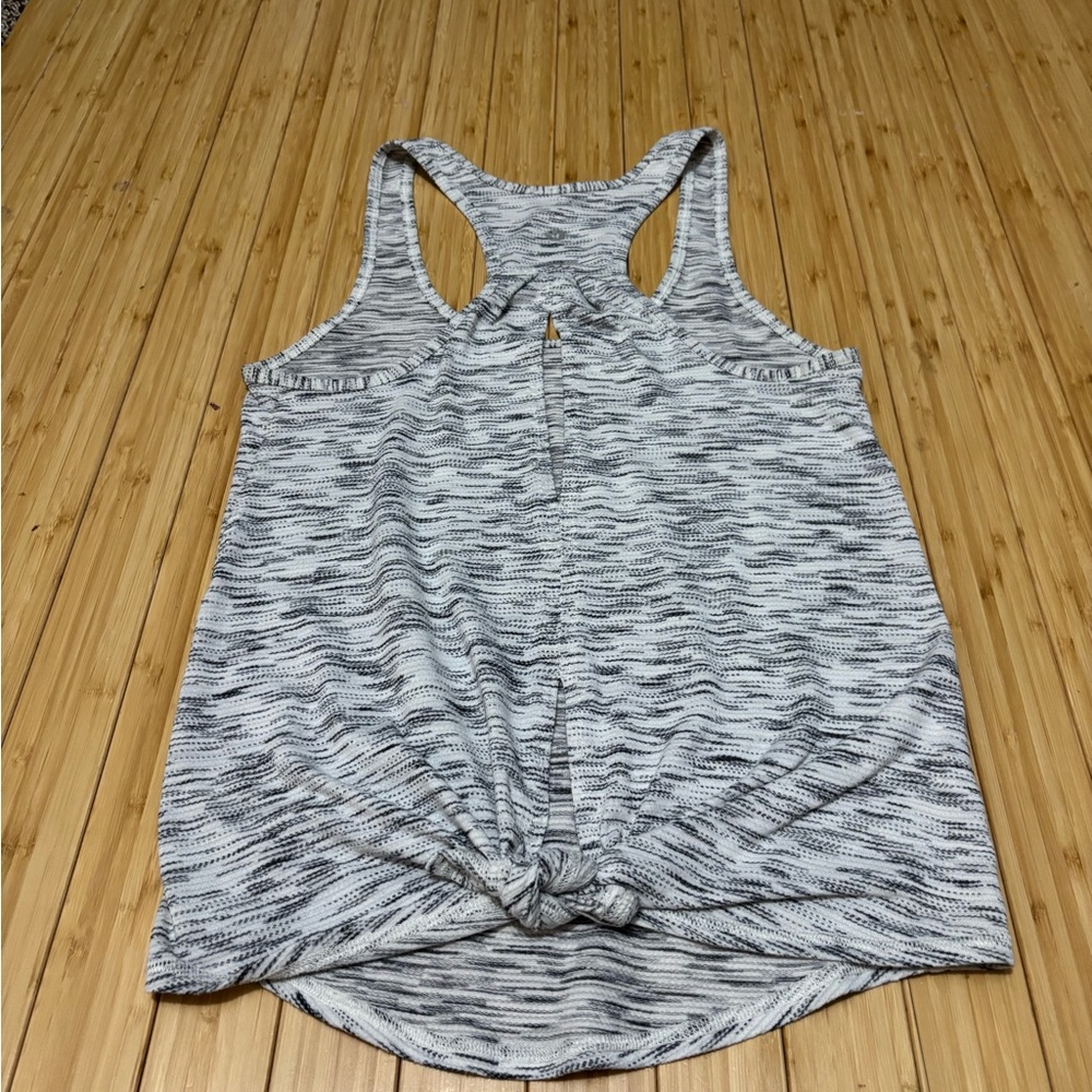 Lululemon tank with cut out back and optional back tie. No tags Measures a  4. - Picture 3 of 7